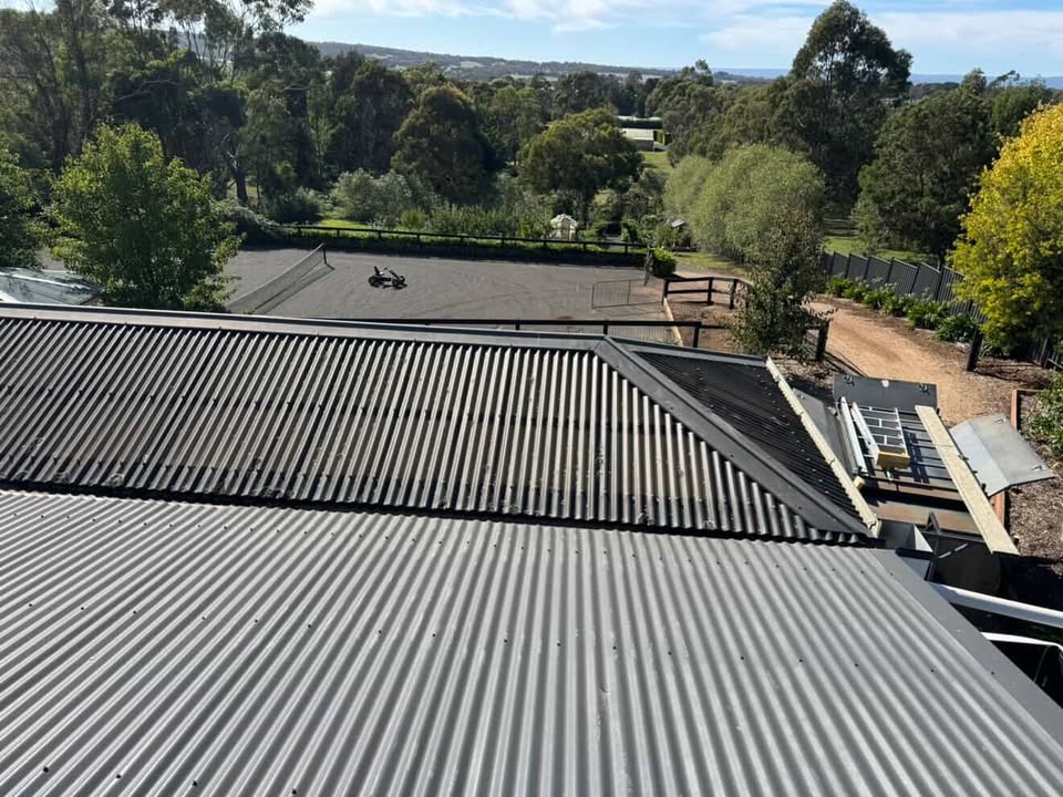 High-quality metal roof installation with scenic landscape